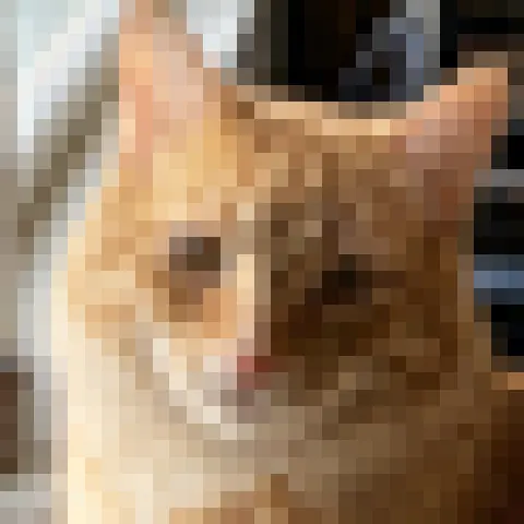 Close-up of the cat's face in the 128-pixel photo, just a few blocks of color