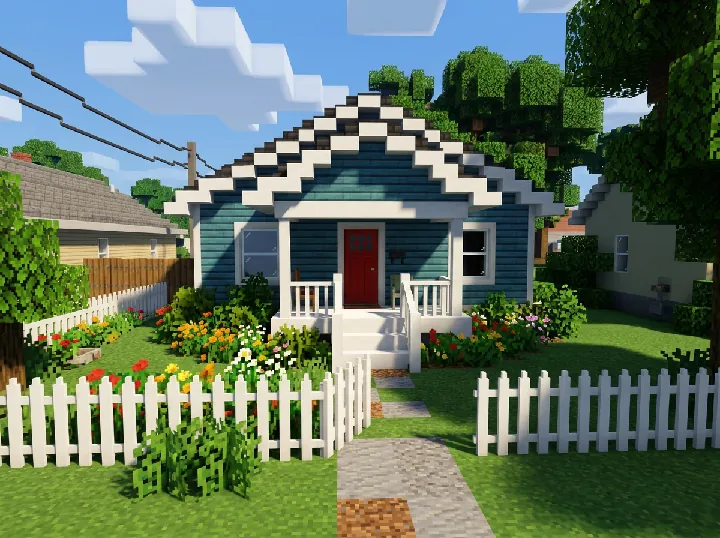 The blue house rebuilt from cube blocks with pixel textures, a white porch, a red door and a blocky picket fence under a blocky sky